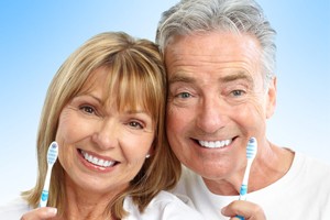 Smiling Couple with Toothbrushes