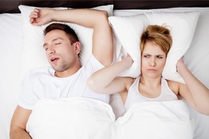 Man Snoring Wife Covering Ears