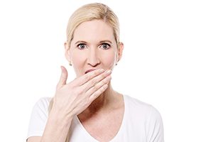 Woman Covering Her Mouth