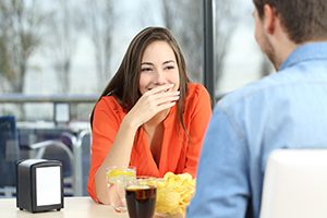 Woman Hiding her Smile