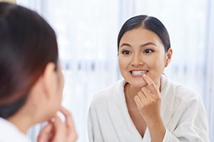 Woman Looking At Her Teeth