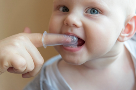 Brushing Baby Teeth with Finger Brush